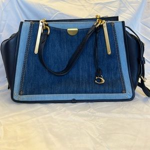 Coach multi-color denim and brass handbag.